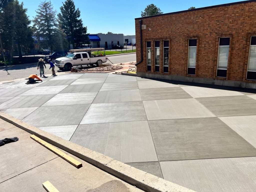 Concrete specialists brooming diamond pattern