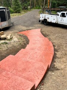 Custom colored stamped concrete stair pathway
