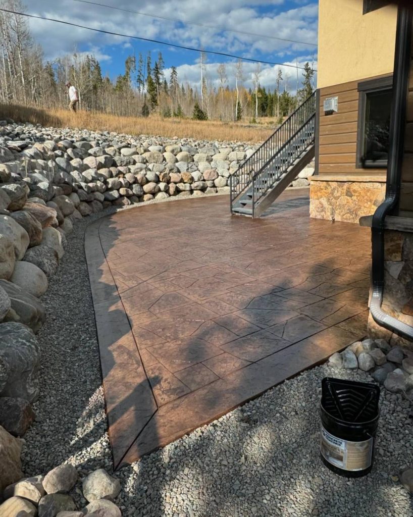 Custom red colored stamped concrete patio in Silverthorne home