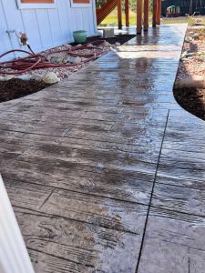 Custom stamped concrete walkway with wood finish
