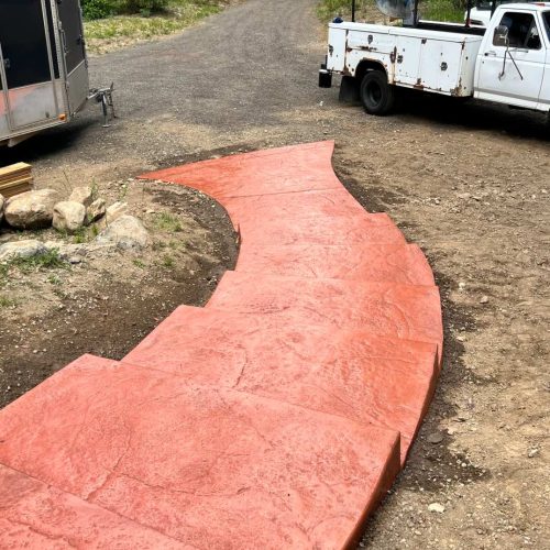 Custom colored stamped concrete stair pathway